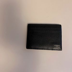 Real leather tumi wallet. Bought from tumi store. Used but in good condition